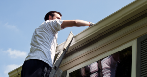 Cleaning gutters in preparation for winter - mobile homes